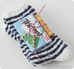 a pair of blue and white striped socks with a bar of soap tied to it