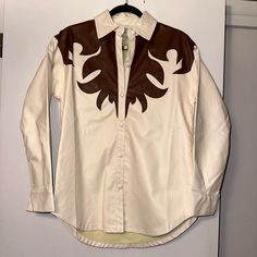 Princess Polly Women’s Jacket Henderson Western Style Jacket Full Button Up To Collared Neckline Long Sleeves With Button Cuffs White With Brown Embroidered Design Size Xs / S Nwt Measurements Armpit To Armpit: 20” Armpit To Bottom Hem: 15” To Side | 18” To Lowest Point Armpit To Sleeve Hem: 18” 55% Polyurethane | 45% Cotton Dry Clean Only Smoke-Free, Cat-Friendly Home Embroidered Leather Jacket, Brown Faux Leather Jacket, Leather Blazer Jacket, Suede Moto Jacket, Black Faux Leather Jacket, Leather Jacket Style, Button Up Jacket, Cropped Leather Jacket, Brown Leather Jacket