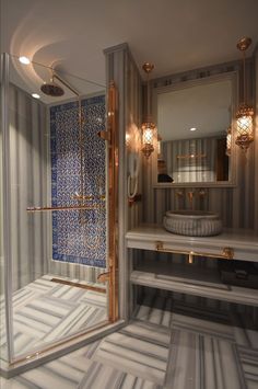 the bathroom is decorated in gold and white