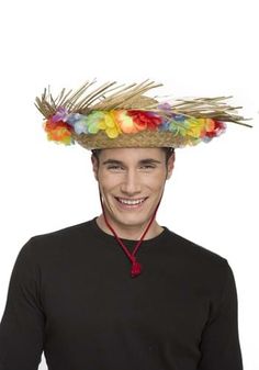 a young man wearing a straw hat with colorful flowers on it's head and smiling at the camera