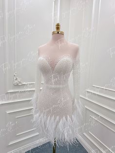 a mannequin with white feathers on it