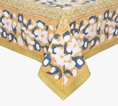 an image of a table cloth with blue and yellow designs on it's edges