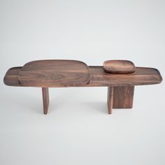 a wooden bench with two plates on it