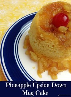 pineapple upside down mug cake on a blue and white plate with the words pineapple upside down mug cake