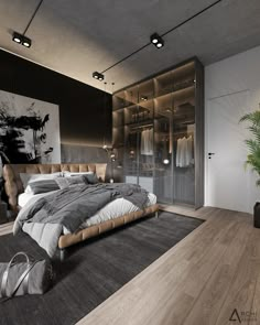 a large bed sitting in the middle of a bedroom next to a plant on top of a hard wood floor