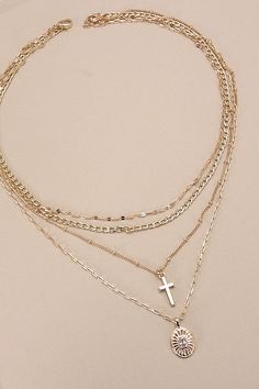 Multi-Layer Cross Oval Charm Necklace, a striking blend of faith and style, perfect for expression. ??This necklace features multiple layers adorned with intricately designed cross and oval charms, creating a captivating and meaningful accessory. Crafted with meticulous attention to detail and quality, each layer adds depth and dimension to the design, making it a versatile piece that complements any ensemble.?? Product Details:length: ??16", 17", 18", 19"charm: ??.75"ext: ??3" Ball Chain Extclasp: Lobster Clawmetal finish: ??Gold Platedproduct: Lead & Nickel Compliantanti-tarnish: Double E-coating Cross Necklace | Chain | Religious Necklace | Layered Necklace | Gold Necklace | Gold | Rhinestones | Simple | Pendent | Charm | Cross | Stacking Necklaces | Mom | Mama | Gift | Necklace | Sprin Layer Oval, Stacking Necklaces, Layered Cross Necklace, Layered Crosses, Necklace Layered, Stacked Necklaces, Gold Cross Necklace, Mama Gifts, Gold Charm Necklace