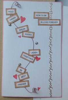 a handmade greeting card with words and hearts on it, attached to a clipboard