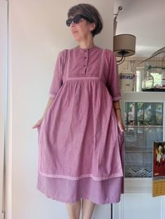 "Vintage 70-80s pale pink dress. Calico print maternity dress. Pure cotton waist up buttoned apron dress. 100% cotton. Made in India. Size XS-S. From shoulder to shoulder 15\"38cm From neckline to edges 18,5\"47cm Sleeve length 13\"33cm Empire waist 34,5\"86cm Length 43\"109cm." Vintage Pink Prairie Dress For Daywear, Calico Print, Vintage Long-sleeved Smock Dress, Pale Pink Dress, Pink Apron, Black Pleated Skirt, Rose Pale, Apron Dress, Maternity Dress