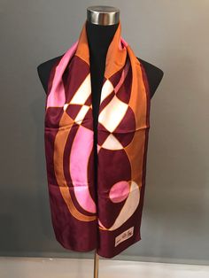 "Absolutely fabulous, mod scarf by Creation Elle Aime Paris in a pink, gold and magenta colorways. The scarf measures approximately 60\" x 14\". Signed \"Creation Elle Aime\". Tag is missing. In excellent vintage condition. FREE SHIPPING EVERYWHERE Prices are listed for Canada and USA only but if you wish to have them shipped elsewhere, please message me the shipping address and I will gladly send you a quote. We proudly reuse shipping material when we can to cut down waste to prevent our belove Vintage Pink Silk Scarves, Pink Vintage Silk Scarves, Pink Silk Vintage Scarves, Vintage Pink Silk Scarf, Retro Red Silk Scarf, Retro Silk Scarf, Gold And Magenta, Hot Pink Scarf, Retro Scarf