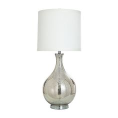 a silver table lamp with a white shade on the base and a light bulb attached to it