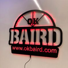 a neon sign with the words ok, bairdd on it