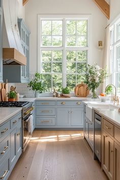 a kitchen with blue cabinets and white counter tops is pictured in this image from the inside