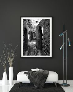 a black and white photo hanging on the wall