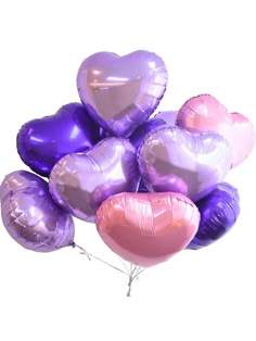 a bunch of heart shaped balloons on a stick