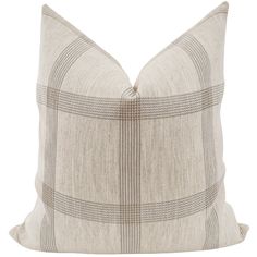 a beige and black plaid pillow on a white background