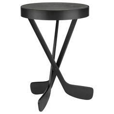 a black table with two crossed legs and a small round top on the bottom is shown