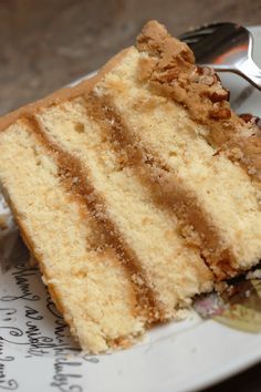 a piece of cake sitting on top of a plate next to a knife and fork