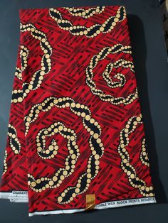 DESCRIPTION Red, Beige and Black African Ankara Fabric. This is high quality African print is 100% cotton and it's 45 inches wide. It is used for making African Clothing, African quilts, & For Home decoration. FYI: Print is Double sided. The listing is for 2yards, 3yards, 6yards and Headwrap Each piece of fabric measures: 70-72in by 45in for 2yards 105-108in by 45in for 3yards 210-216in by 45in for 6yards 70in by 22in for Head wrap If you purchase more than one yard, you will receive one continuous piece. *If you require more than what I have listed, feel free to send me email. CARE INSTRUCTIONS:•DO NOT BLEACH•Hand wash with cold water and mild soap or Dry clean•Press with warm iron on the wrong side only. Color may be different due to your monitor Red Fabric With Unique Traditional Pattern, Red Traditional Block Print Fabric, Traditional Red Block Print Fabric, Traditional Red Ankara Fabric, Red Batik Print Cotton Fabric, Red Cotton Fabric With Batik Print, Red Cotton Fabric With Traditional Patterns, Red Ankara Fabric With Traditional Patterns, Traditional Red Cotton Fabric