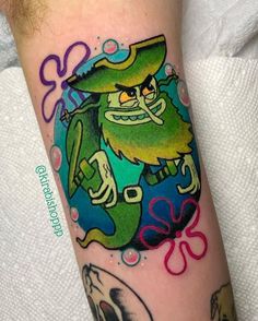 a person with a tattoo on their arm wearing a green hat and holding a pipe