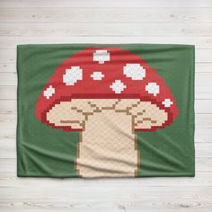 a blanket with a mushroom design on it