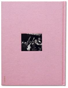 a pink book with a black and white photo