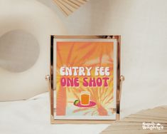 there is a sign that says entry fee one shot on the table next to an object