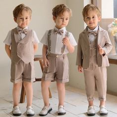 three little boys dressed up in formal clothes