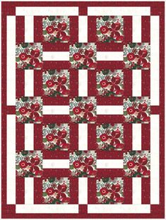 a red and white quilt with flowers on the front, one block has been made into a