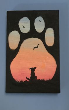 a painting of a dog's paw with birds flying in the sky behind it