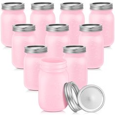 pink mason jars with lids are shown next to a silver lid and a white canister