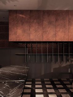 a black and white checkerboard floor in a room with copper colored cupboards