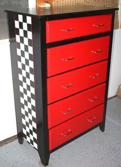 a red and black dresser with checkered drawers