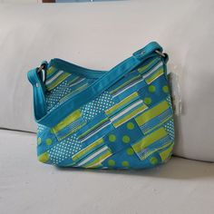 Turquoise And Lime Green 11x7 Canvas Bag With Shoulder Strap. Blue Casual Hobo Bag With Double Handle, Casual Blue Hobo Bag With Double Handle, Casual Blue Crossbody Hobo Bag, Blue Rectangular Shoulder Bag With Zipper Pouch, Retro Green Pouch Bag, Turquoise Shoulder Bag For Everyday Use, Blue Canvas Tote Bag With Zipper, Blue Canvas Tote Bag With Zipper Closure, Retro Green Pouch Shoulder Bag