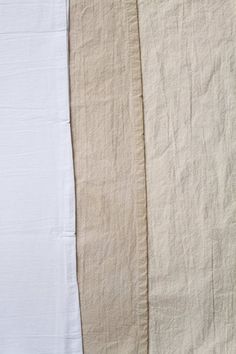 three pieces of white linen are lined up against each other