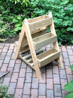 a wooden shelf sitting on top of a brick walkway