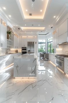 a large kitchen with marble counter tops and white cabinets