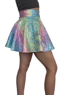 Introducing our stunning Rainbow Ombre Holographic Skater Skirt, inspired by Taylor Swift's iconic Lover outfit and designed for the ultimate music festival and rave experience. Crafted with care in the USA, this skirt combines captivating style with unmatched quality to ensure you make a bold statement on the dance floor.Crafted from high-quality stretchy rainbow avatar spandex, this skirt offers a comfortable and flexible fit that allows you to move freely and dance with ease. The flattering s Fitted Mini Skirt For Concert, Spring Disco Skirt For Club, Multicolor Rave Bottoms For Party, Rave Multicolor Party Bottoms, Rave Style Multicolor Party Bottoms, Rave Mini Skirt For Spring, Rave Skirt For Spring Party, Spring Rave Party Skirt, Spring Rave Skirt For Party