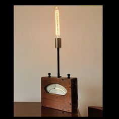 a wooden box with a light on top of it