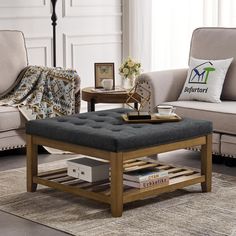 a living room with two couches, a coffee table and a rug on the floor