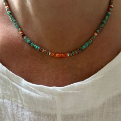 This stunning and colorful necklace is handcrafted with AAA Grade genuine natural 4mm Kingman turquoise heishi beads from the Kingman Turquoise mine in Kingman Arizona, and all natural hand selected orange spiny oyster heishi beads. This necklace is accented with either gold filled or sterling silver spacer beads, and finished with a high quality designer lobster clasp. This necklace reminds me of a beautiful vibrant sunset and showcases the depth and richness of the beautiful turquoise and spin Bohemian Heishi Beads Turquoise Necklace Gift, Artisan Turquoise Necklace With Heishi Beads For Gift, Multicolor Hand-strung Turquoise Necklace Gift, Multicolor Hand-strung Spiritual Turquoise Necklace, Spiritual Multicolor Hand-strung Turquoise Necklace, Multicolor Single Strand Turquoise Necklace Gift, Multicolor Single Strand Turquoise Necklace For Gift, Handmade Multicolor Turquoise Necklace For Healing, Gift Turquoise Necklace With Gemstone And Heishi Beads