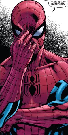 the spider - man is covering his face with his hands and looking at something in front of him