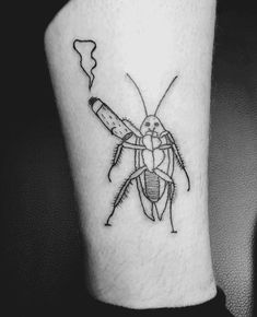 a black and white photo of a bug on the leg