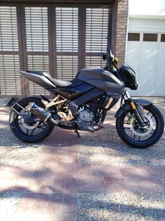 a motorcycle parked in front of a garage