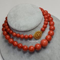 DESCRIPTION: Thank you for coming in! Spectacular 18K solid gold necklace with Mediterranean Sardinia Coral sphere beads, no dye, 100% natural tomato red color. 9.5mm-17.15mm large coral beads, 128 grams with a beautiful 18k solid gold clasp~Our favorite color for coral! The beads are premium quality, you do not find hairline cracks which are common with Mediterranean coral beads. Accompanied with GIA report number 2191866911 to assure your investment! You'll get the necklace you see! SIZE of co Luxury Necklace With Round Red Coral Beads, Elegant Orange Hand-strung Necklace, Hand-strung Red Coral Jewelry For Gifts, Elegant Red Coral Necklaces With Polished Beads, Gift Jewelry With Hand-strung Red Coral, Elegant Coral Beaded Necklaces, Elegant Coral Round Bead Necklaces, Elegant Single Strand Red Coral Necklace, Elegant Single Strand Red Coral Necklaces