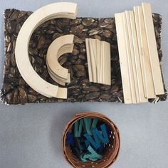 a basket filled with lots of different items on top of a blue flooring area