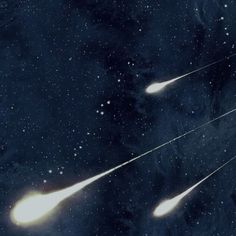 an artist's rendering of two comets flying through space