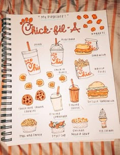 an orange and white spiral notebook with some food on the pages, including drinks and cookies