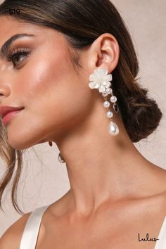 It's easy to finish your perfect outfit when you have the Lulus Beautiful Charm Gold and Ivory Floral Pearl Drop Earrings! These darling earrings feature floral-inspired posts that give a ruffled effect, supporting twin lengths of slender, gold-toned chains that have faux pearl beads along their lengths. Post backs. 3. 25" Long. 90% Acrylic, 10% Steel. Imported. Lulus | Beautiful Charm Gold and Ivory Floral Pearl Drop Earrings. Pearl Chains, Earring Pearl, Jewel Tone Wedding, Lulu Fashion, Floral Fashion, Accessories Jewelry Earrings, Pearl Chain, Pearl Drop Earrings, Jewel Tones