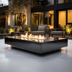 an outdoor fire pit sitting on top of a patio