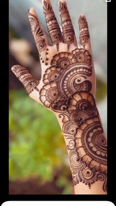 a hand with henna on it